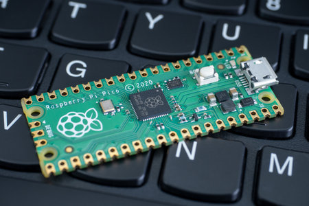 Galati, ROMANIA - February 09, 2021: Close-up of Raspberry Pi Pico, Raspberry Pi 4b and Raspberry Pi Zero W on a laptop keyboard.のeditorial素材