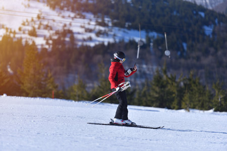 Sunny Ski Day Selfie: Adventurous Woman Snaps Photo While Shredding the Mountainの写真素材