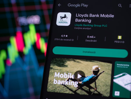 Galati, Romania - March 30, 2023: Lloyd Bank smartphone app Stock: Navigating the Market's Highs and Lowsのeditorial素材