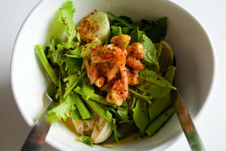 Mixed vegetable in Thai noodle salad served in a white bowlの写真素材
