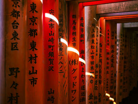 Red shrine gates that are placed orderly making them like a long tunnel at Fushimi Inari Shrine, Kyoto. shot on 22 october 2018.のeditorial素材