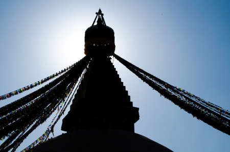 the famous buuha eye gazing out sleepily from each side of the tower are those of the all seeing primordial buddha.perched a top a hill on the western edge of the kathmandu valley.の写真素材