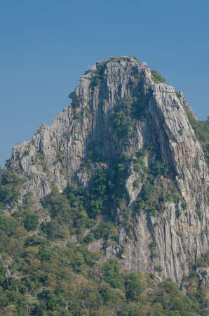 Kao Nor Kao Kawg is limestone mountain in Nakon sawan Province and have green paddy ,blue skyの写真素材