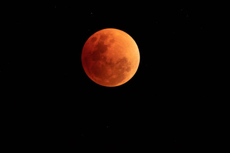 In the night time. the moon have red colour and full phaseの写真素材