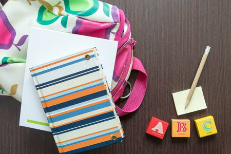 School is back. Some items depicting schooling for young children including backpack, books, pencil,...