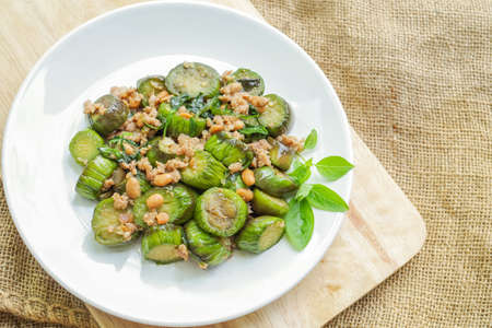 Stir-fried eggplant with minced pork, soybean and sweet basilの写真素材