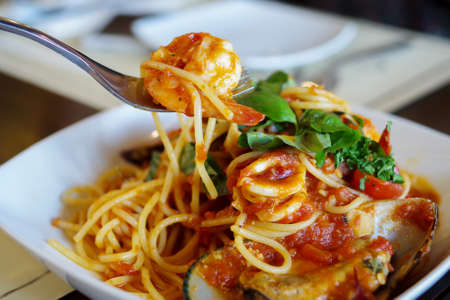 Eating spagetti seafoodの写真素材