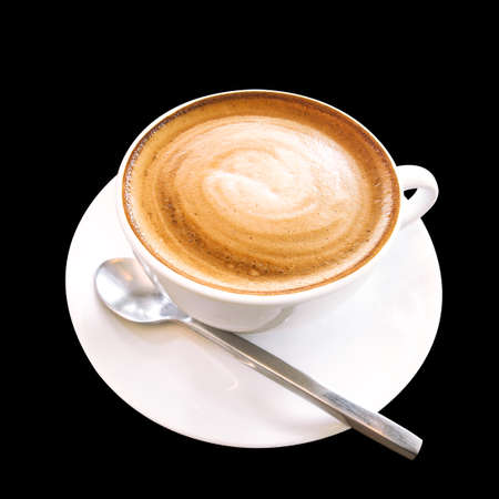 Hot coffee cappuccino cup with spiral milk foam isolated on black background, clipping path included.の写真素材
