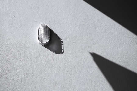 Wall light and shadow on concrete wall textured, abstract black and white architecture background.の写真素材
