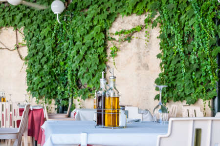 Olive oil and aceto in a tableの写真素材