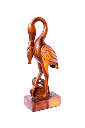 Carved wooden bird and fish isolated on  white background.の写真素材