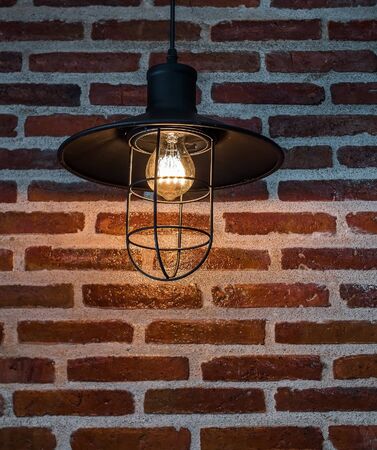 Hanging lamps and brick wall in the kitchenの写真素材