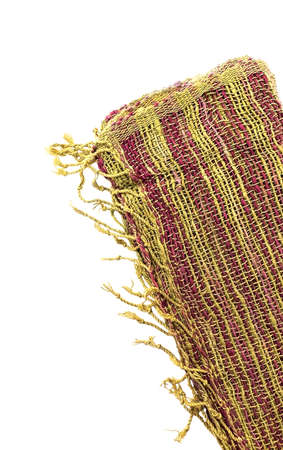 A scarf woven from yarn on a white background.の写真素材