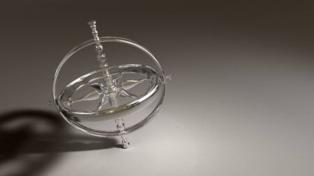 Spinning chrome gyroscope object on a shaded generic backgroundの写真素材