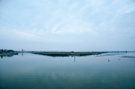 Landscape of the lagoon in the early morning with clouds on the skyの写真素材