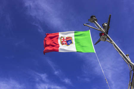 Italian Merchant Marine flag proudly waves in the windの写真素材