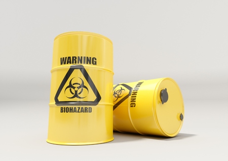 Yellow metal barrels with black biohazard warning sign isolated on white backgroundの写真素材