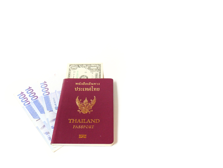 A passport of Thailand and a banknote isolate on white background with copy space, Traveling concept.の写真素材