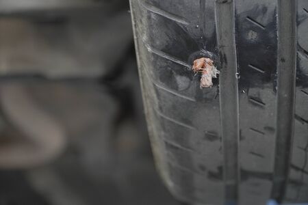 Close-up of a tire that has been repaired with a tire repair kit.の写真素材