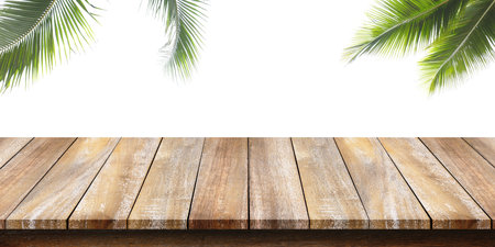 Empty of wooden table top with a coconut green leaf on white background. For montage product display or design key visual layouts.の写真素材