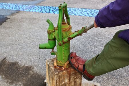 The Operating of Antique draw water deviceの写真素材