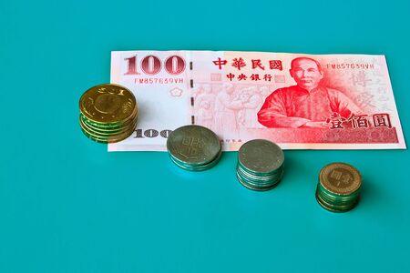 The Taiwan currency with One hundred yuan and Coins in circulationの写真素材