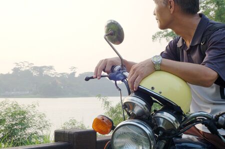 A man who Riding a motorcycle for trip