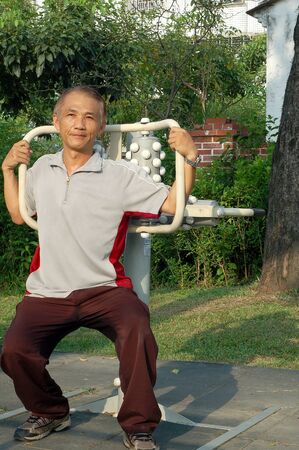 The People who doing back massage by Equipment in Park