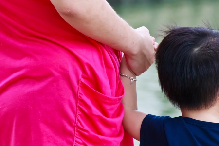 Mother holding the child for enhancing parent-child relationshipの写真素材