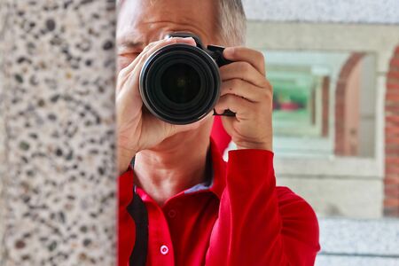 A photographer who taking a picture for Creationの写真素材