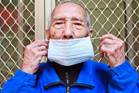 Elderly people to wear a mask for Disease preventionの写真素材