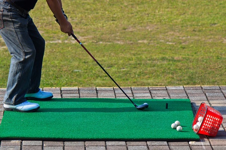 Playing golf at Golf Driving Range for Leisure and Health careの写真素材