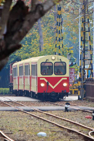 The Electric tourist train being through level crossingのeditorial素材
