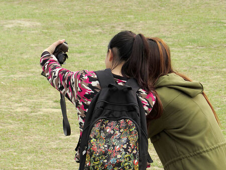 Two girls who Take pictures by Themselvesの写真素材