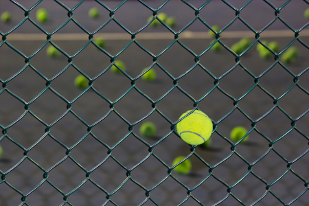Tennis court with Scattered tennis balls for Trainingの写真素材