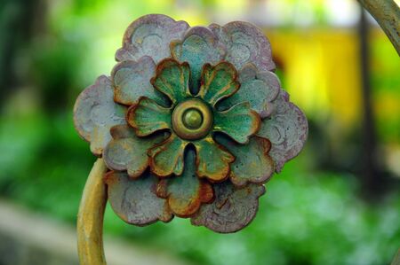 Curved steel flower with rust の写真素材