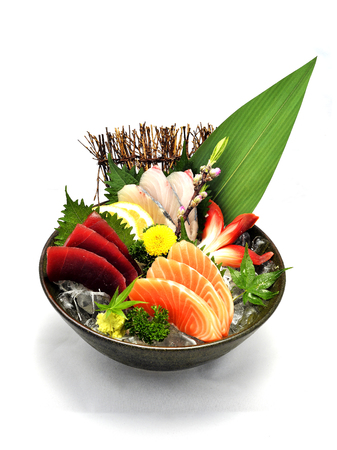 Japanese tradition food. Various medium Sashimi set on ice bowl with white isolated backgroundの写真素材