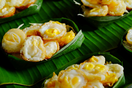 "Kai krok"Quail Egg mortar Served in Krathong made from banana leaves. Thailand tradition food in market steedの写真素材