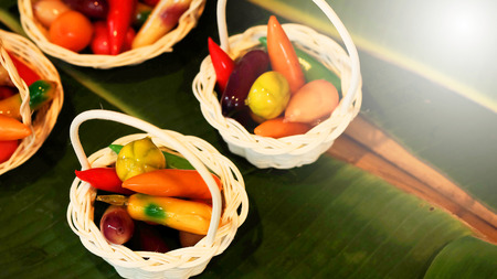 (KANOM LOOK CHOUP) Deletable Imitation Fruits. Famous Thailand tradition dessert Made of nuts than forming the fruit and paint by food coloring coated with jellyの写真素材