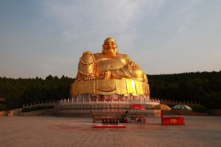 Giant gold buddha in Chinaの写真素材