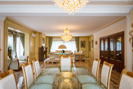 The dining room in classical style, light furniture, marble, luxury.の写真素材