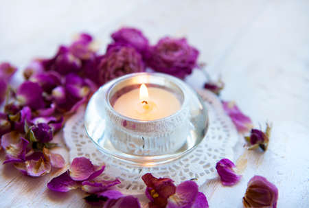 Candle in the dried rose petals ,aromatherapy  luxury spa resortの写真素材