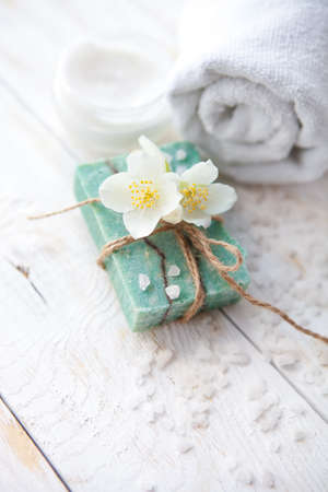 Spa setting with  jasmine blossom, natural handmade soap  and sea saltの写真素材