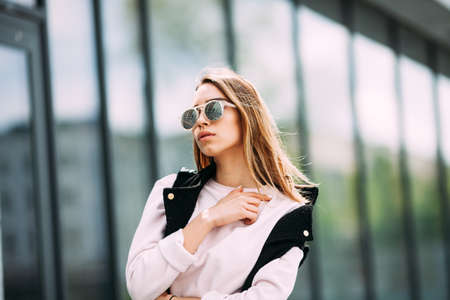 close-up portrait of a young sexy girl hipster The concept of street fashion. Young beautiful model in the city.の写真素材