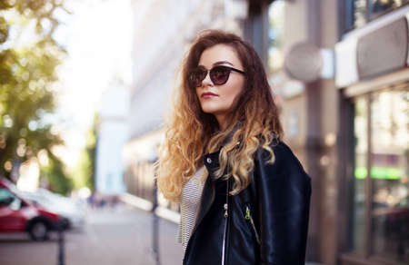 Close-up Fashion woman portrait of young pretty trendy girl posing at the city in Europe,summer street fashionの写真素材