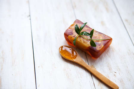 Spa and wellness setting with natural soap and aromatherapy on white wooden background.flat layの写真素材