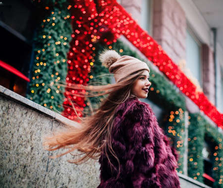 Close up fashion street stile portrait of pretty girl in fall casual outfit Beautiful brunette posing outdoorの写真素材