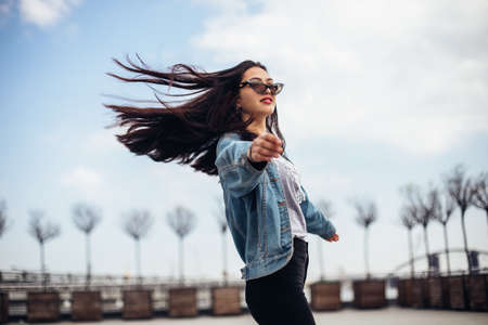 Portrait of wonderful white female model with bright makeup expressing energy in good day.Stylish happy young woman.の写真素材