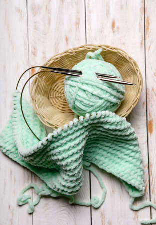 Knitting project in progress.home hobbies, cozy knitted plaid.close up.の写真素材