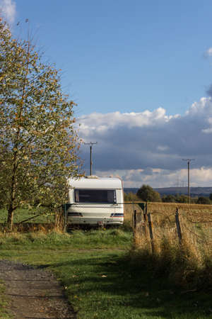 Caravan in the garden in the sunshine in autumnの写真素材